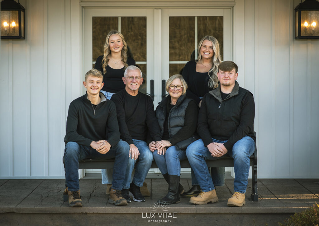 family portraits Harrisburg PA Family portrait of the front porch of their home in Harrisburg, photographed by Lux Vitae Photography