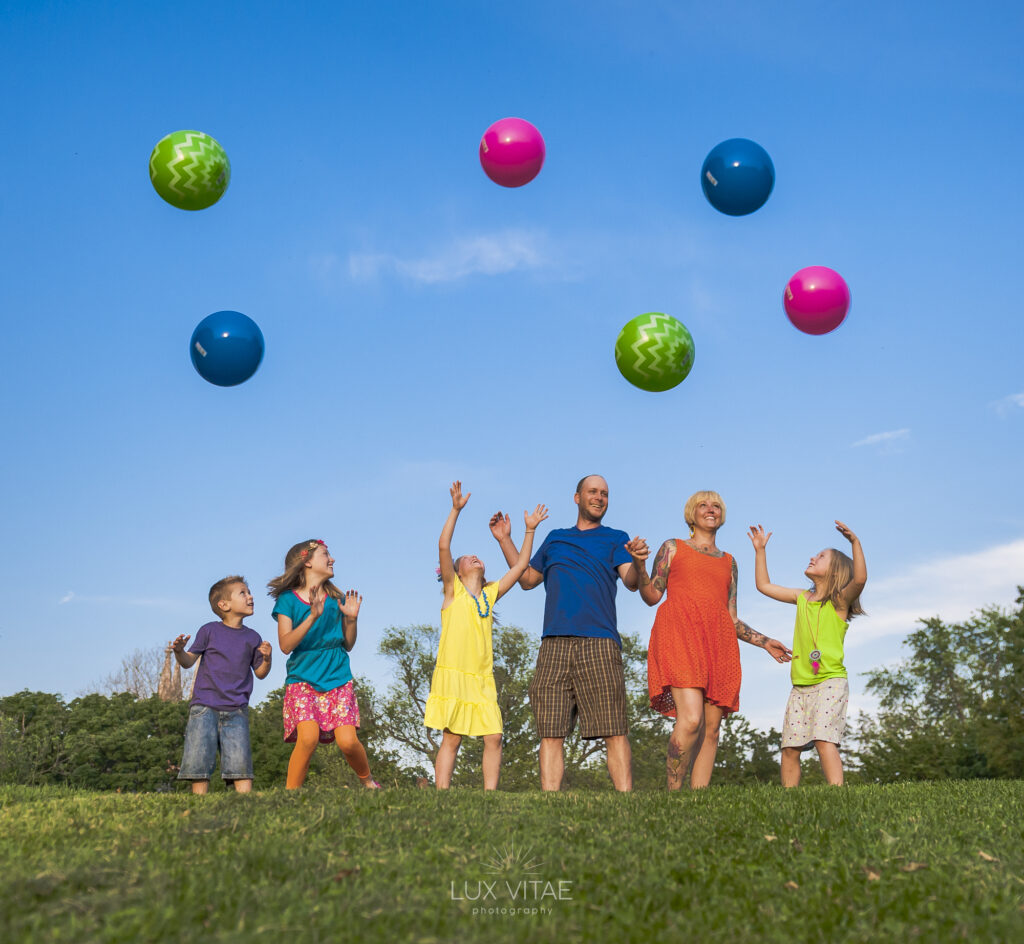 Lancaster-PA-family-portraits-park Family portrait colorful balls in Lancaster, photographed by Lux Vitae Photography.
