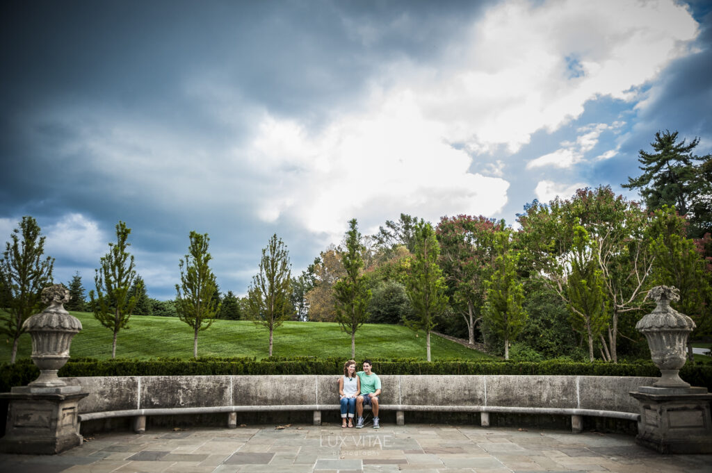 Outdoor engagement session in a garden on sunny day