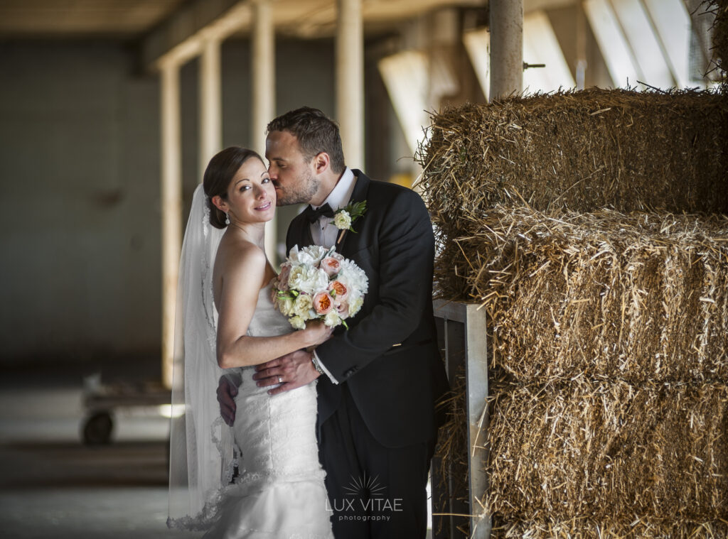 Lauxmont farms PA wedding bride groom kiss Bride and groom kiss during their wedding at Lauxmont Farm, Wrightsville, photographed by Lux Vitae Photography in Central PA.